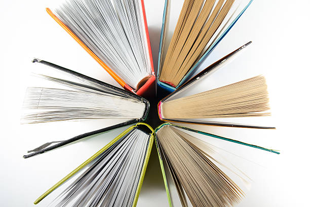 istock Top view of colorful hardback books in a circle. 500401294