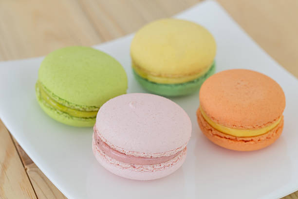 istock Colorful macarons on wooden background. 500401526