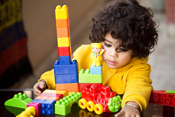 istock Little boy playing with plastic block toys 500401766