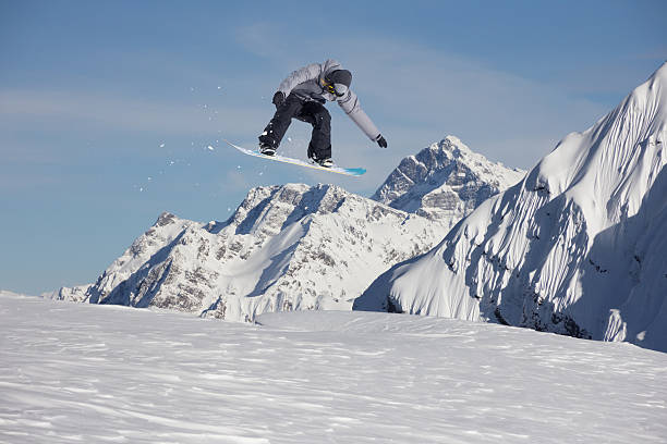 istock Flying snowboarder on mountains. Extreme sport 500402566