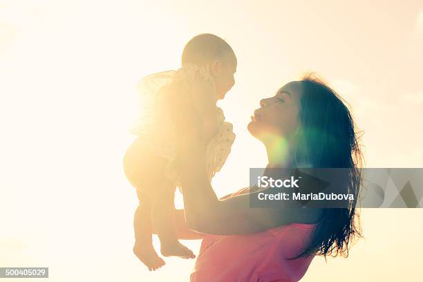 Silhouette Of Mother And Baby Stock Photo - Download Image Now - Mother, Baby - Human Age, Futuristic
