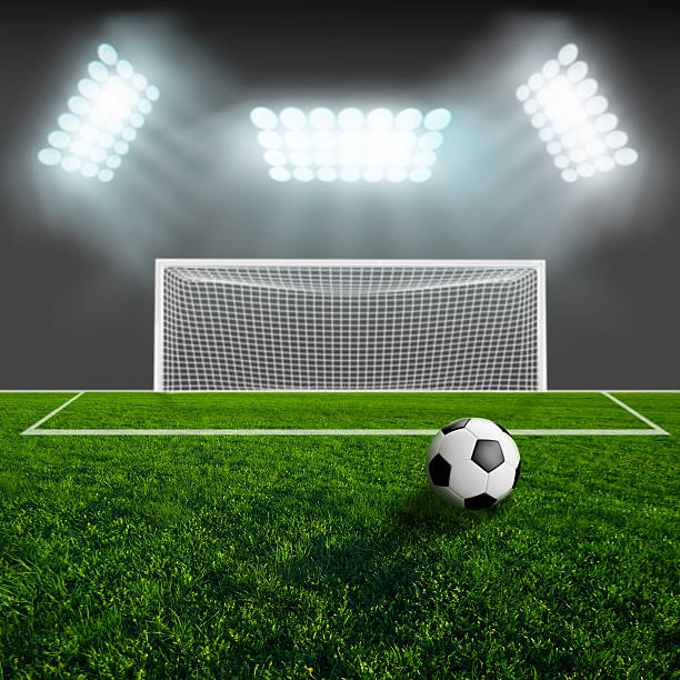 istock Soccer ball on green stadium arena 500407377