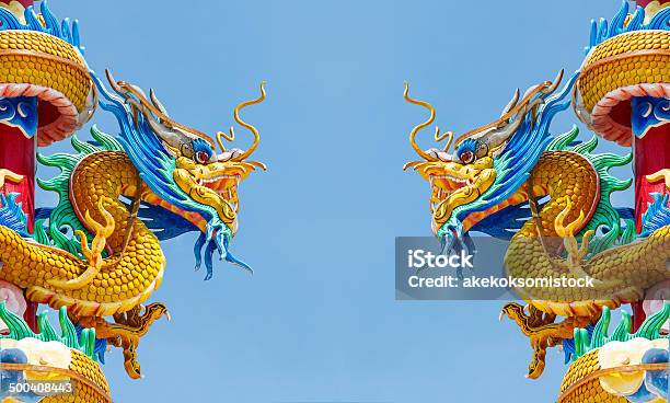 Double Golden Dragon Statue On Blue Sky Background Stock Photo - Download Image Now - Ancient, Animal, Art