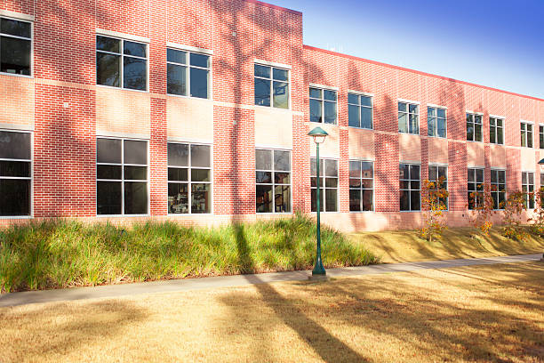 istock Architecture: Contemporary glass, brick building on college campus. 500408817