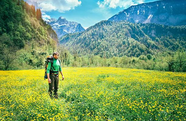istock Young Man Traveler with backpack relaxing outdoor 500423228