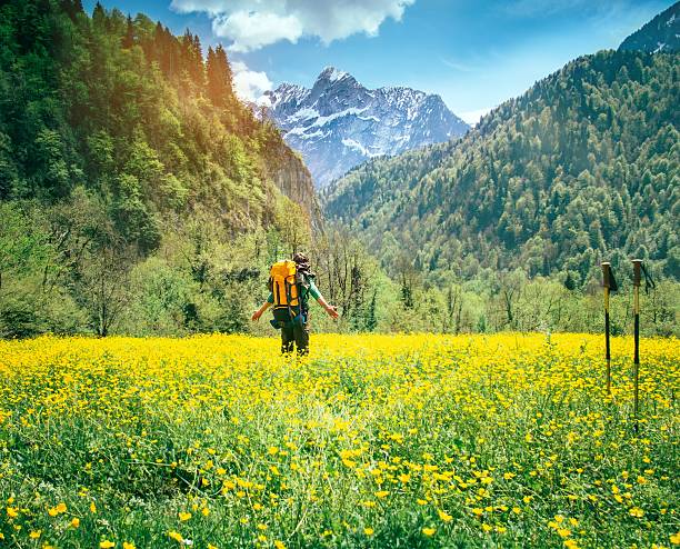 istock Young Man Traveler with backpack relaxing outdoor 500423264