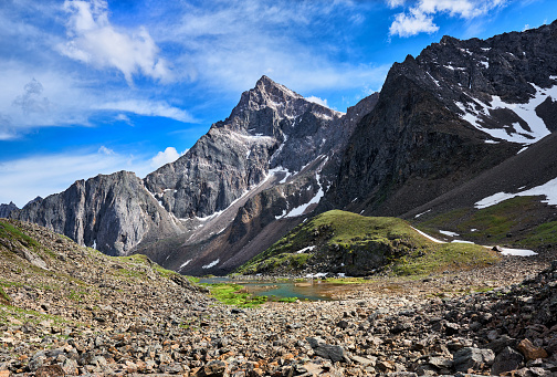 Pointed peak in the mountains of Eastern Siberia. Summer landscape