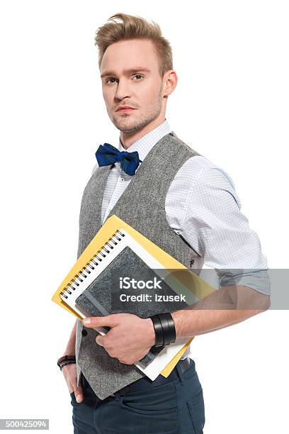 Fashionable Man Wearing Tweed Vest Holding Notebooks Stock Photo - Download Image Now