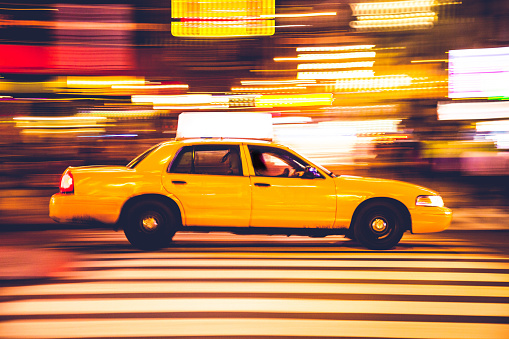New York, NY, USA - July 5, 2022: Yellow cabs on the streets in Midtown Manhattan, New York City.