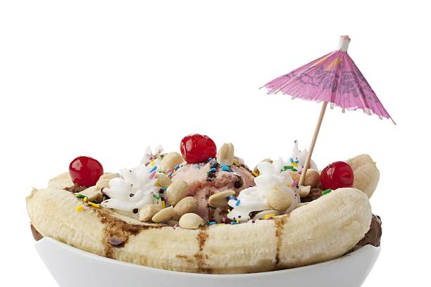 istock bowl of banana split with little umbrella 500427872