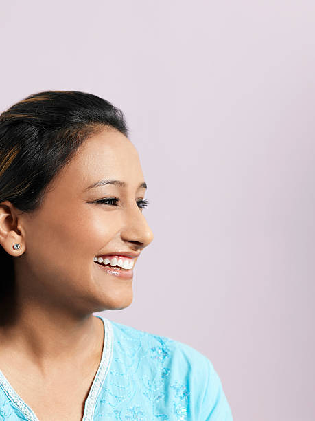 istock Smiling Asian Woman Looking Away 500428233