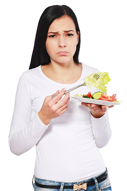 istock woman boring to eat salad 500428716