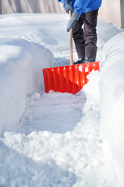 istock Shovel Snow on Sidewalk after Winter Blizzard Storm 500429226