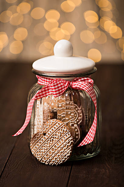 istock Gingerbread cookies in a jar on a wooden background 500430310