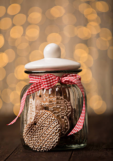 istock Gingerbread cookies in a jar on a wooden background 500430462