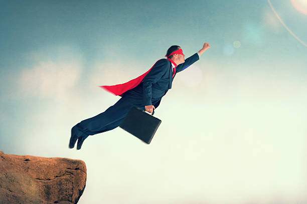 istock flying superhero businessman 500431999