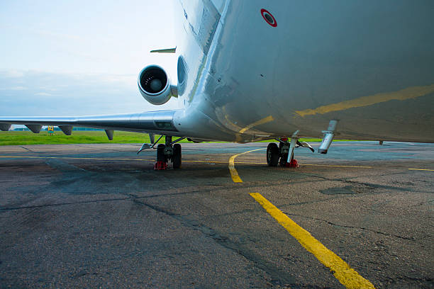 istock shiny fuselage jet passenger plane against the bright blue sky 500432368