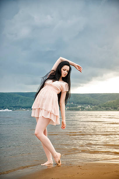 istock Beautiful young woman on a sandy beach 500432541