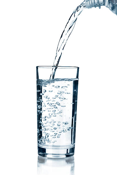 istock water pouring in glass isolated on white background 500432879