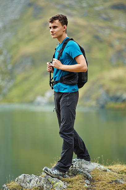 istock Hiker boy by the lake 500433054