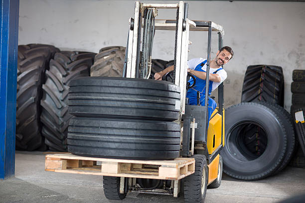 istock Forklift carries sell car tires 500433662