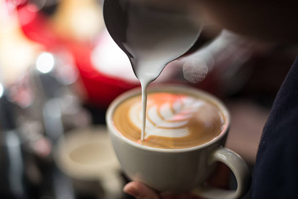 istock hand of barista making latte 500435492
