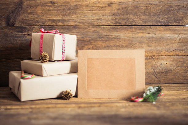 istock Christmas gift box with cards  on a wooden background 500435768