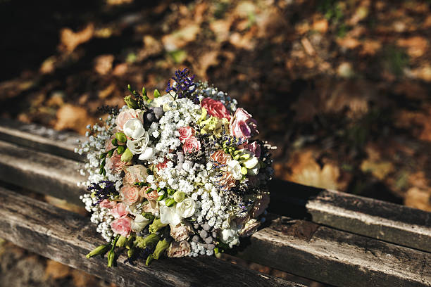 istock beautiful bridal bouquet lying on a bench 500435862