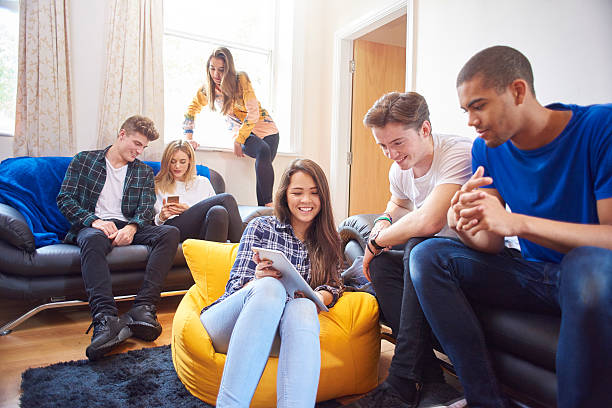istock university friends at home 500436312