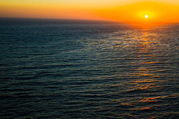 istock Sunset over the ocen near a beach 500440645