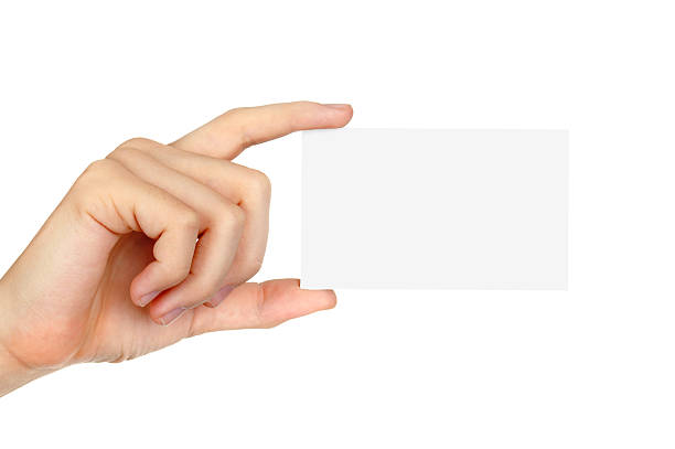 istock Female hand holding a blank business card 500442095