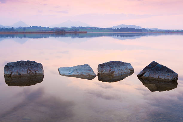 istock tranquil sunset at lake hopfensee, bavaria, allgaeu, germany 500443513