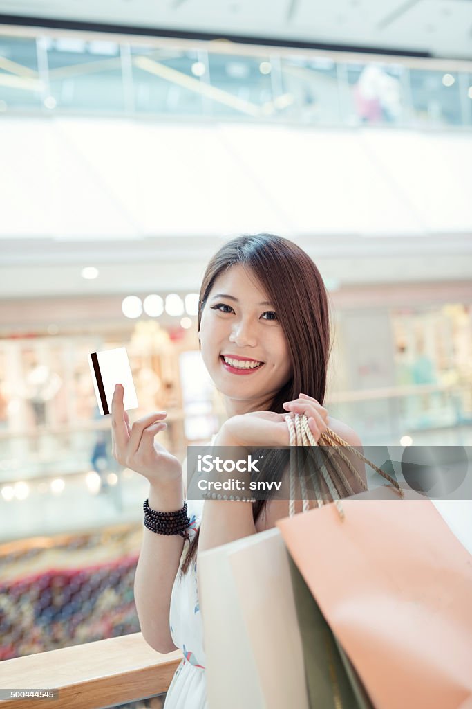 girl shopping at luxury mall in kowloon shanghai china Woman holding shopping bags 20-29 Years Stock Photo