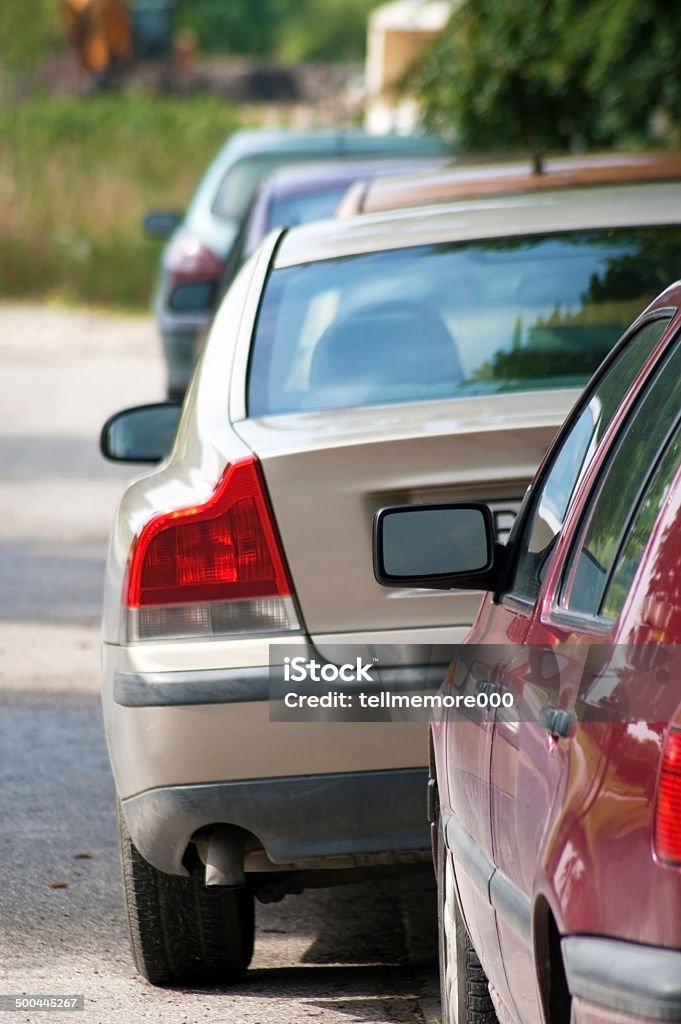 Line of Cars Line of new compact cars at a dealer lot. Narrow dof, with focus on the nearest car. Automobile Industry Stock Photo