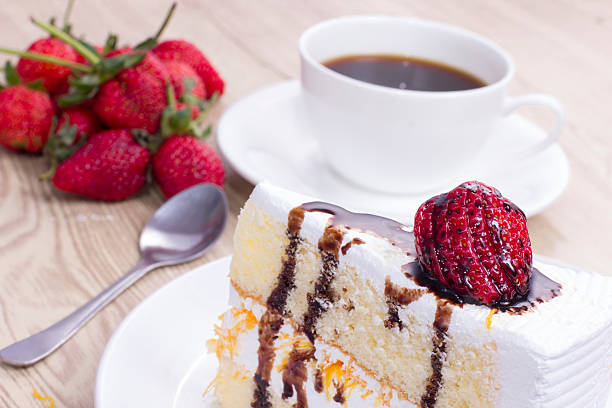 istock cake on the white plate with a cup of coffee 500447637