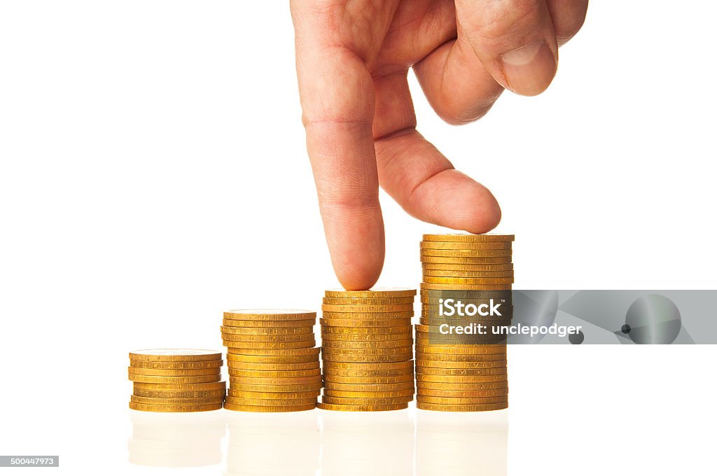 Finger go down to the top of stack coins Business Stock Photo