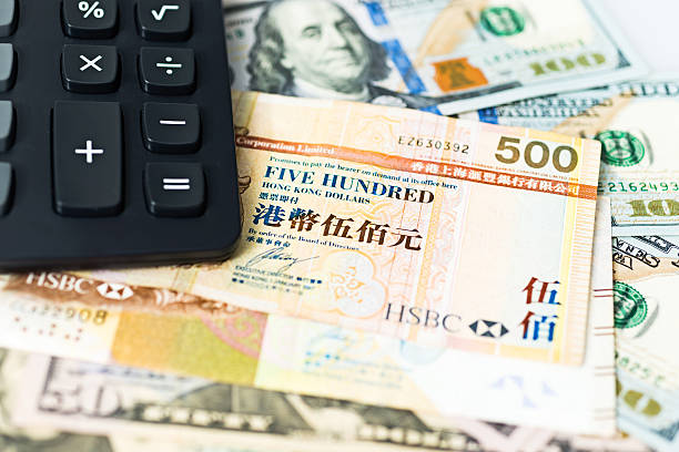 Currency exchange Calculator on US dollar and Hong Kong dollar. hong kong currency symbol stock pictures, royalty-free photos & images
