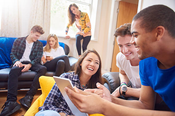 istock young adults at home with their friends 500452804