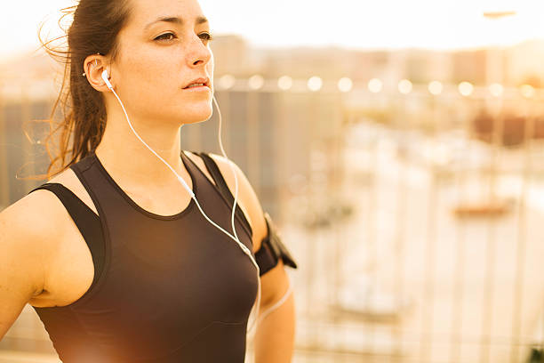istock Beautiful runner takes a break from a fitness session 500452816