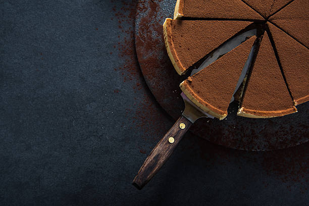 istock Sliced chocolate tort on dark background 500453188