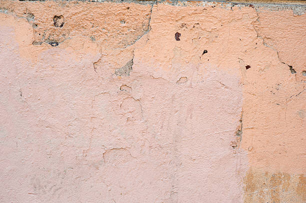 istock Texture of old wall covered with brown stucco 500453452