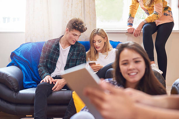 istock young adults at home with their friends 500453610
