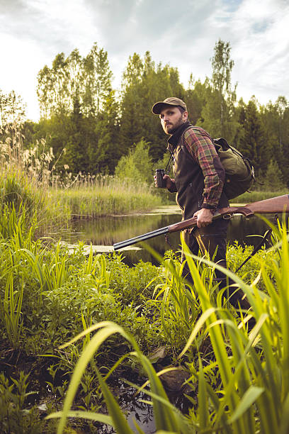 istock Nordic Man Walking Through Swamp in a Forest 500453650