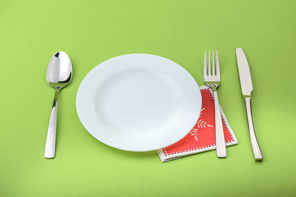 istock Plate fork and knife in a christmas napkin 500454284