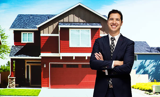 istock Cheerful businessman standing in front of house 500455207