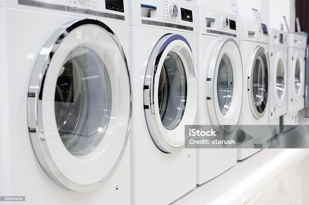 washing mashines in appliance store Washing machines, dryer and other domestic appliance equipment in the store Washing Machine Stock Photo