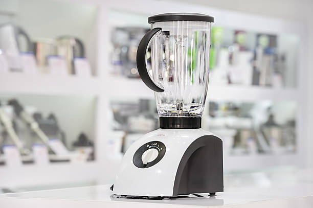 single electric blender in retail store single electric blender at retail store shelf, defocused background butter churn stock pictures, royalty-free photos & images