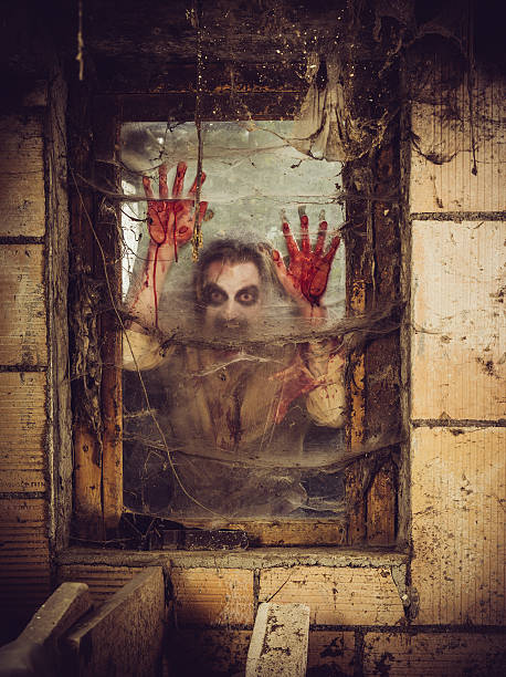 istock Bloody zombie at the window 500456479