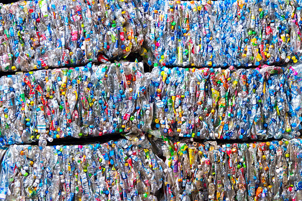 istock Small bales of compacted cans for recycling 500457361