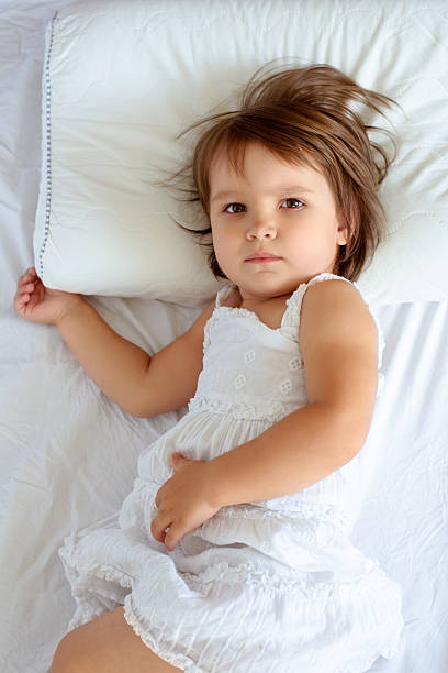 Little girl sleeping on pillow stock photo